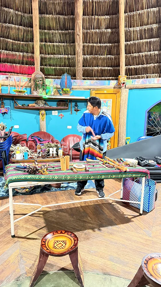 A Kamentsá healer and instrument-maker leading a sound immersion workshop with instruments he built himself, Shanayoy, Colombia
