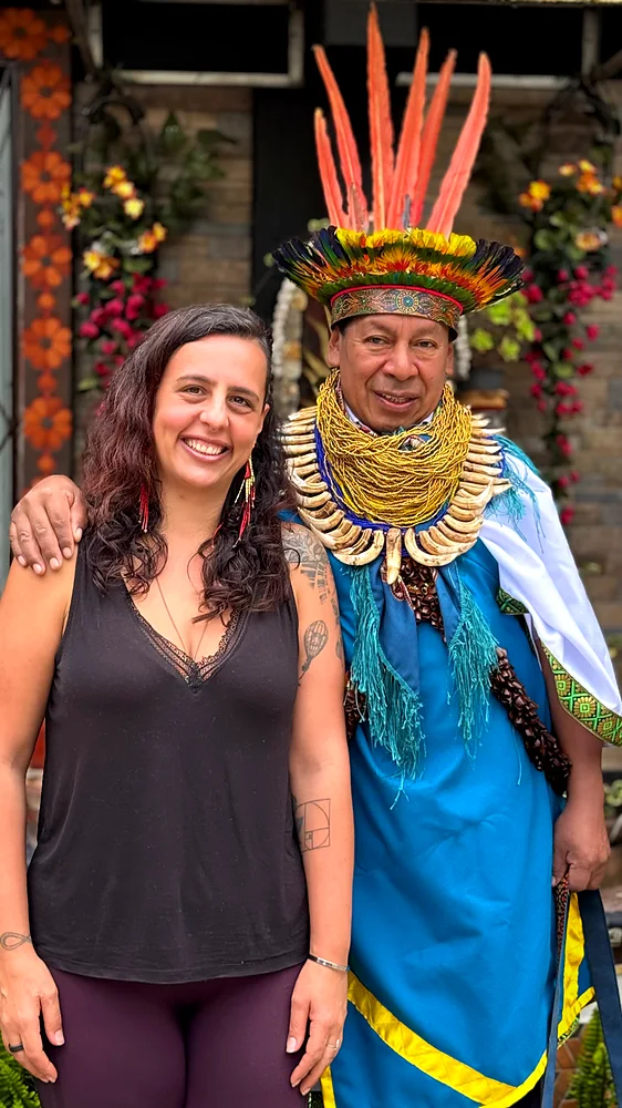 Rosa F. Brissos, PhD, standing with the Taita Mayor at the healing centre in the Sibundoy Valley